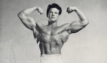 Young Steve Reeves flexing his biceps