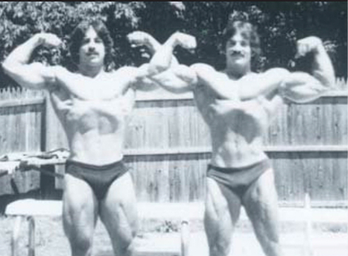 Ray and Mike Mentzer (younger) in a backyard (black and white)