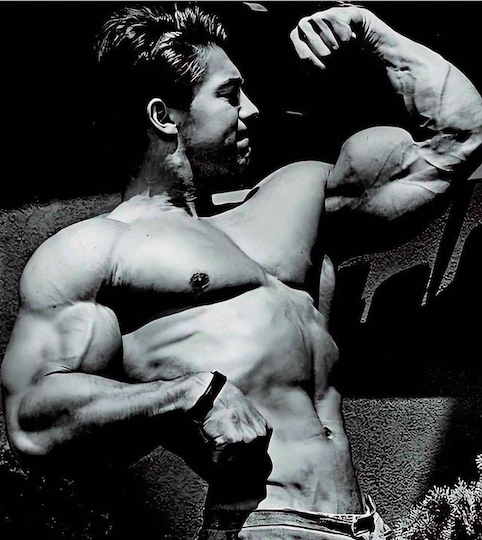 Larry Scott's awesome arms, flexed - black and white