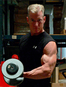 Steve demonstrating alternate dumbbell curls