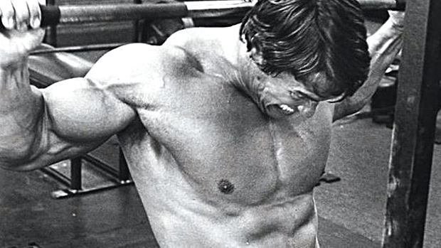 Arnold doing behind-the-neck pulldowns