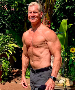 Steve in his backyard giving a little side-chest flex