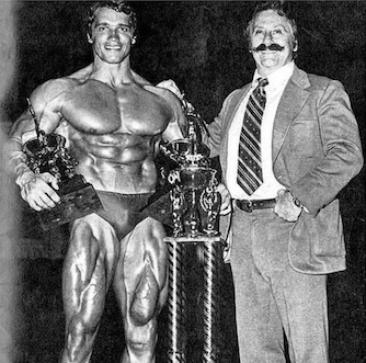 Arnold with trophies and Joe Weider