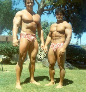 Arnold and Franco wearing Hawaiian trunks