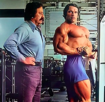 Joe Weider analyzing Arnold's chest development